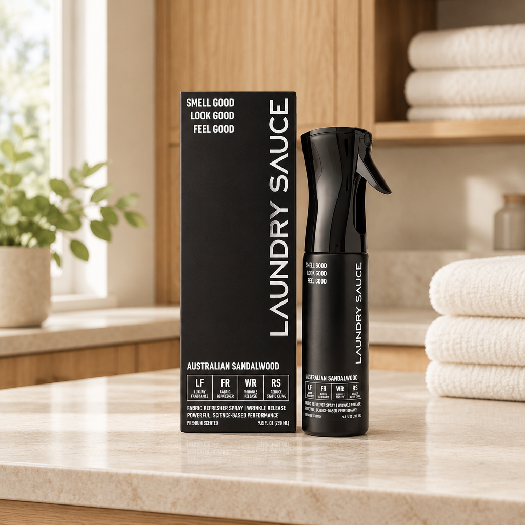 Laundry Sauce Fabric Refresher Spray in a warm neutral laundry room