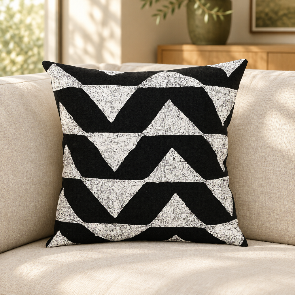 Sadza Triangles Pillow Cover — Ebony styled in a neutral living room